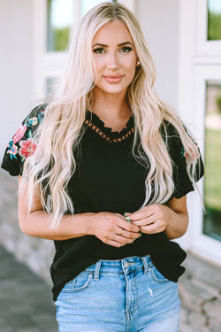 Black high with V -neck and puffy sleeves embroidered with flowers