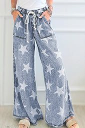 Light blue jeans with stars print and light washing with tightening cord and high waist