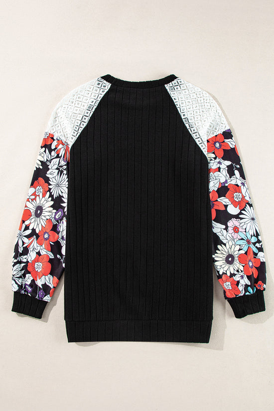 Blusa acanalada negra con mangas largas y mosaicos florales