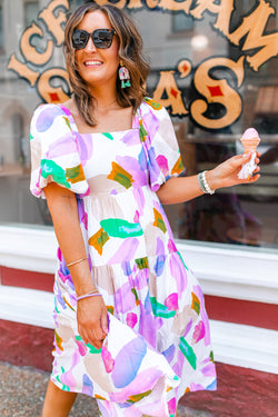 Purple midi dress with abstract print, puff sleeves, smocked back