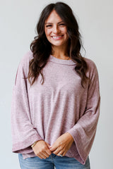 Camiseta con mangas largas y anchas, pétalo de orquídea, costura expuesta, hombros que caen