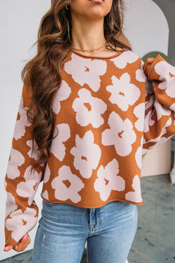 Large brown sweater with long sleeves and round neck with floral pattern