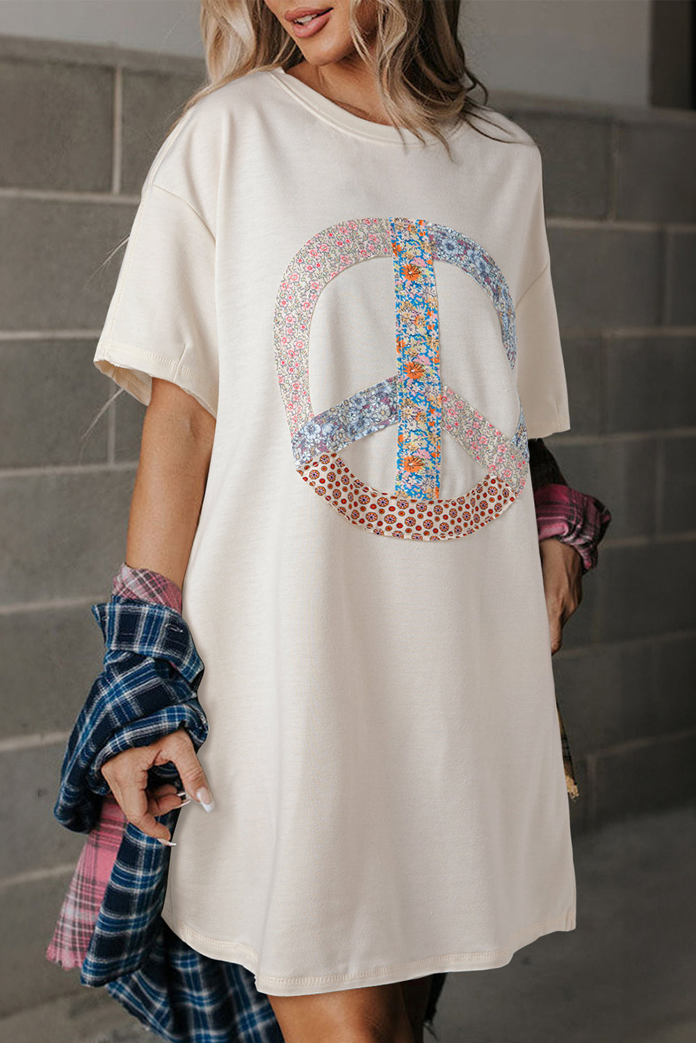 White graphic t-shirt dress with floral motif and sign of peace *