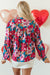 Red blouse with balloon sleeves and floral print, half-boutons