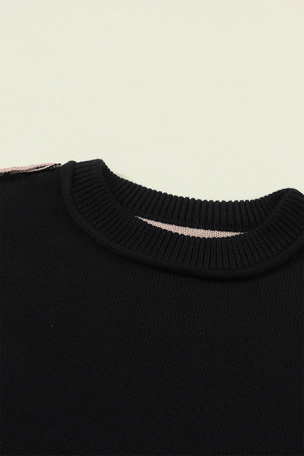 Black sweater with ribbed edge and COLOR BLOCK bishop sleeves