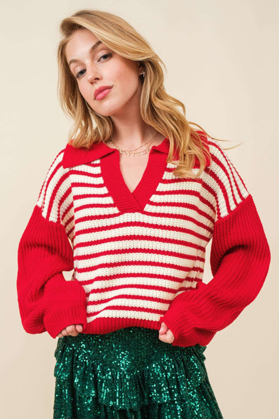 Red striped sweater with lantern sleeves and V -neck and drooping shoulders