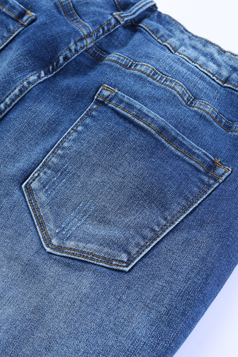 Jeans magri a lunghezza della caviglia di orlo crudo blu