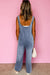 Large overalls in a washed-out denim blue stone with half-boutons and pocket pocket