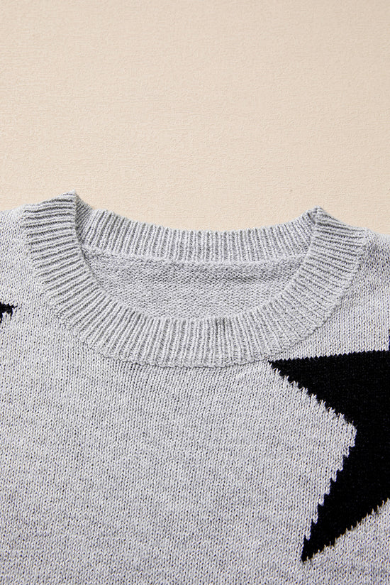 Pull gris à épaules tombantes et motif étoiles