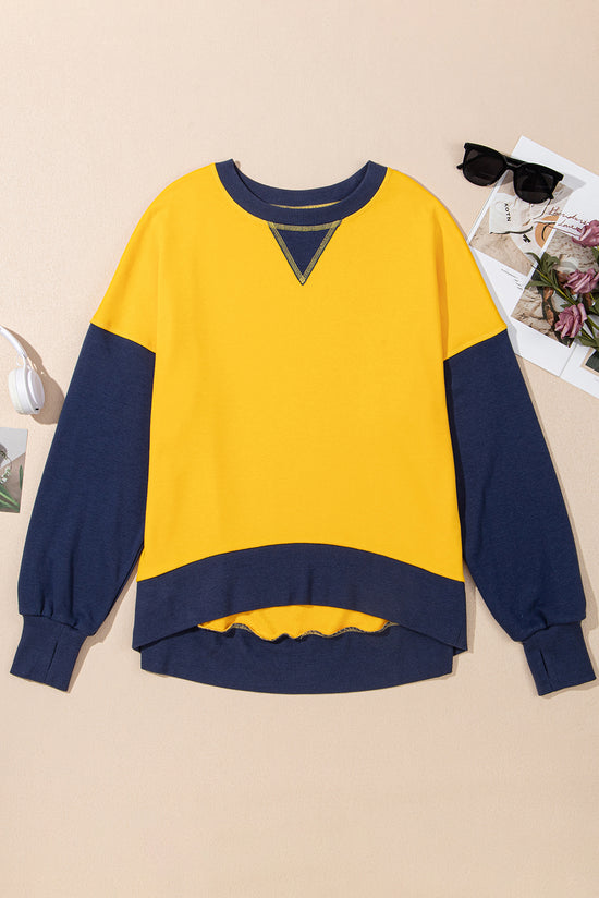 Yellow sweatshirt with dropped shoulders and sleeves with thumb hole