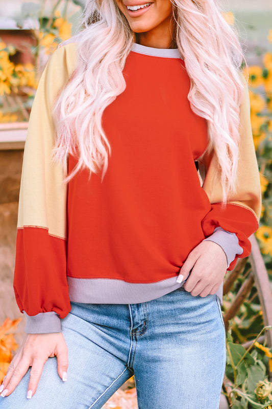 Orangefarbene Farbblockseite schlägt Raglan -Ärmel lous Fit Top