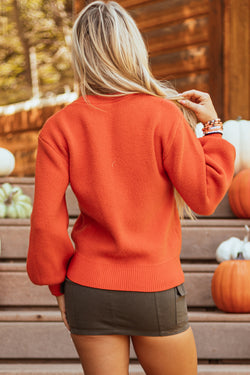 Suéter de hombro naranja y motivo de la cara de calabaza de Halloween