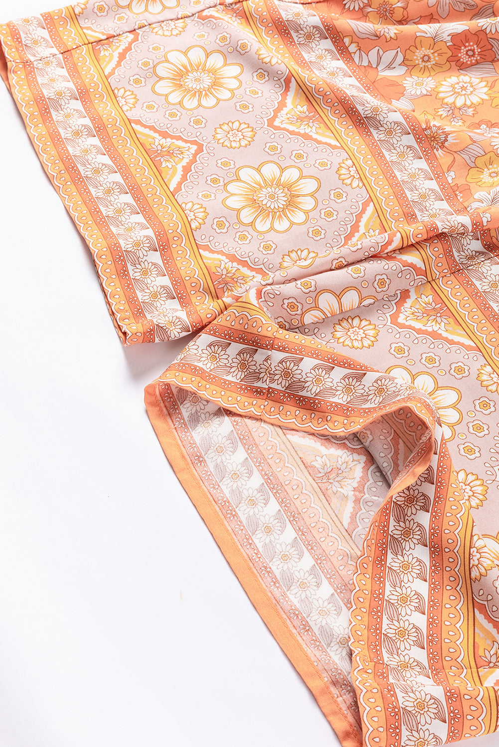 Pantalones anchos con estampado floral bohemio y cintura anudada en naranja pomelo