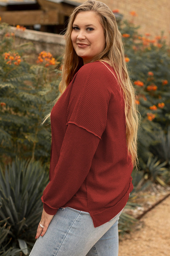 Plus size waffle knit top with exposed seams and gold flame