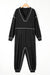 Black baggy jumpsuit with v-neck and flat seam details