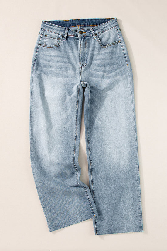 Light -blue right jeans faded with acid and raw edges