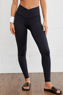 Leggings activos sin costura negra con tamaño arqueado