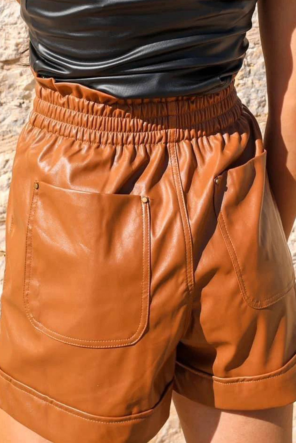 Brown faux leather high waisted shorts with patch pockets