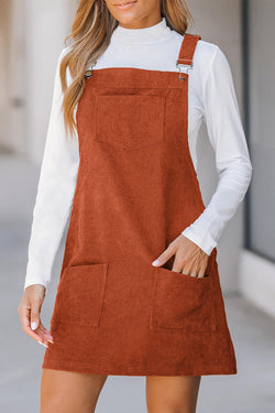 Sleeveless velvet overall dress with pockets before cinnamon units