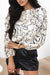 Beige blouse with round neck and abstract print balloon sleeves