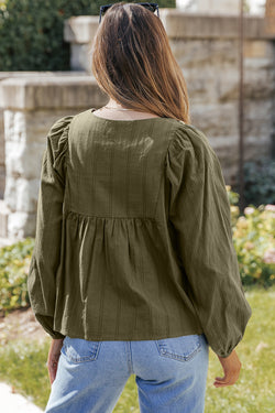 Ample pleated blouse with split and green spokes