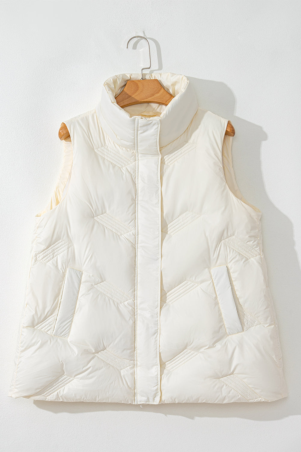 White quilted jacket with high collar and zipper