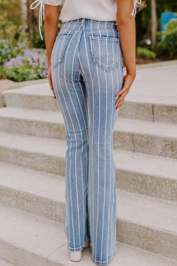 Flared jeans torn with vertical blue sky stripes