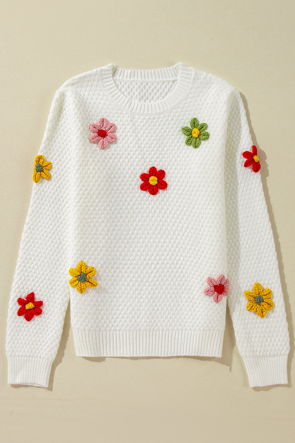 Textured knit sweater with white colorful flower appliques