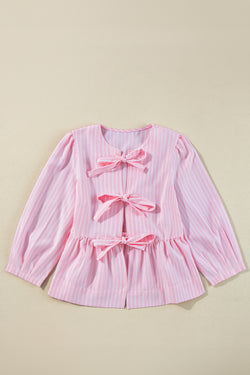 Striking pink blouse and bow tie on the front, round neck, puffy sleeves