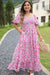 Smocked pink dress with puffy sleeves and large floral print