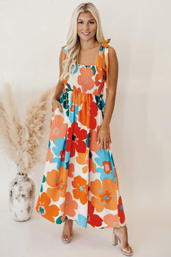 Vestido de naranja largo con flores y tirantes anudados con un busto brotado