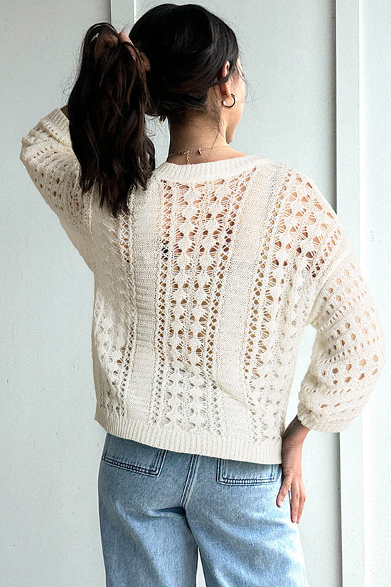 Pull blanc en tricot ajouré à manches bouffantes*