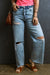 Light blue right jeans torn and torn in raw hem