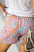 Pantalones cortos decretados con cordón de ajuste y bolsillos de estampado floral rosa lateral