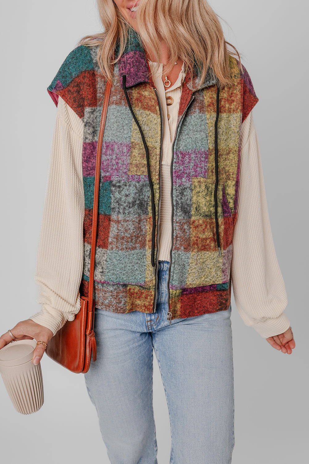 A large zipped vest with multicolored Scottish print with side pockets