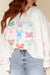 White loose sweatshirt with bow tie pattern and dropped shoulders