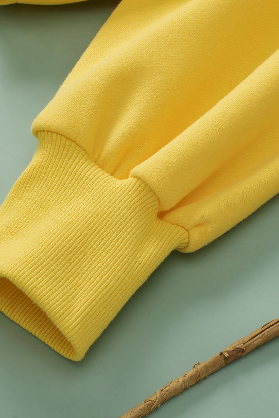 Sweat à capuche zippé jaune avec poche kangourou et bordure côtelée