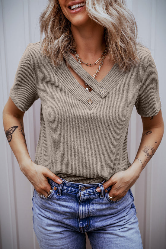 Pale chopped khaki t-shirt with buttoned suspenders and v-collar