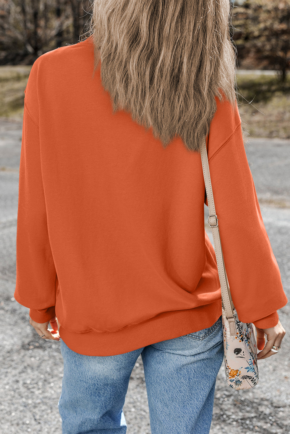 Sweat-shirt orange uni à col rond et épaules tombantes