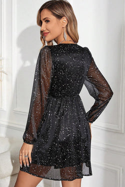 Black long sleeve v-neck dress with glitter mesh overlay