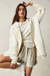 Functional coat with contrasting beige knitted patchwork hood