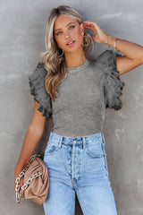Gray ribbed knitting high with fluffy sleeves in polka dot mesh