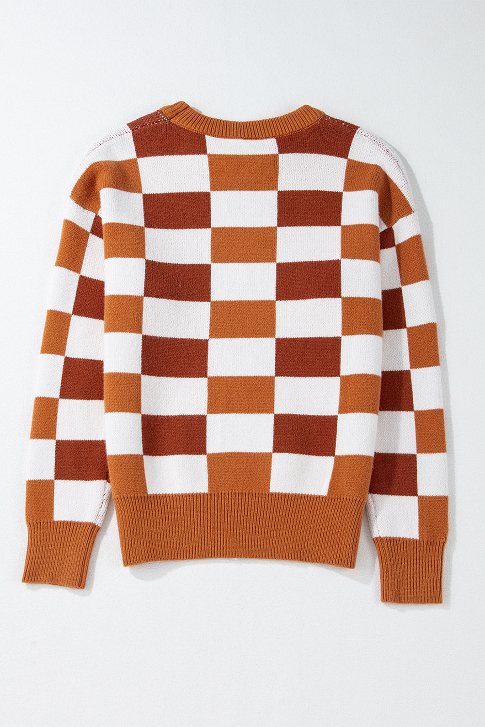 Pull orange à carreaux et bords côtelés *