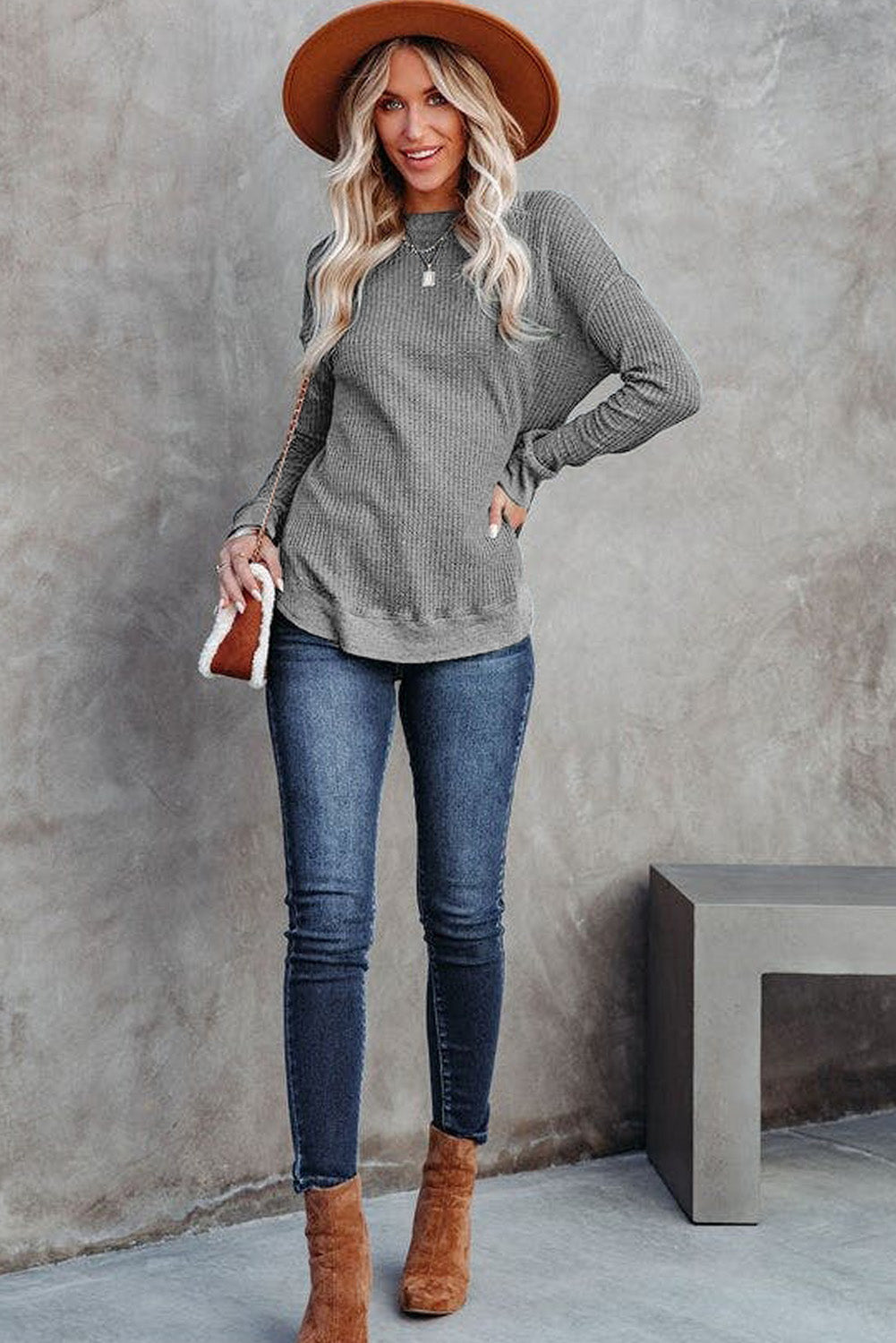 Grey waffle knit top with ribbed trim and crew neck
