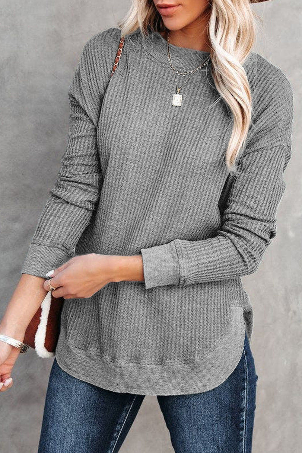 Grey waffle knit top with ribbed trim and crew neck