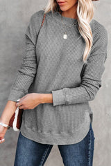 Grey waffle knit top with ribbed trim and crew neck