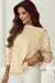 Beige sweatshirt with buttoned sleeves and dropped shoulders