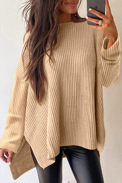 Ample knitted apricot knit sweater with drooping shoulders and side slits