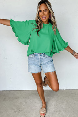 Green blouse with ruffles, round neck *