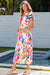 Long floral dress buttoned with floating sleeves and ricrac pink border